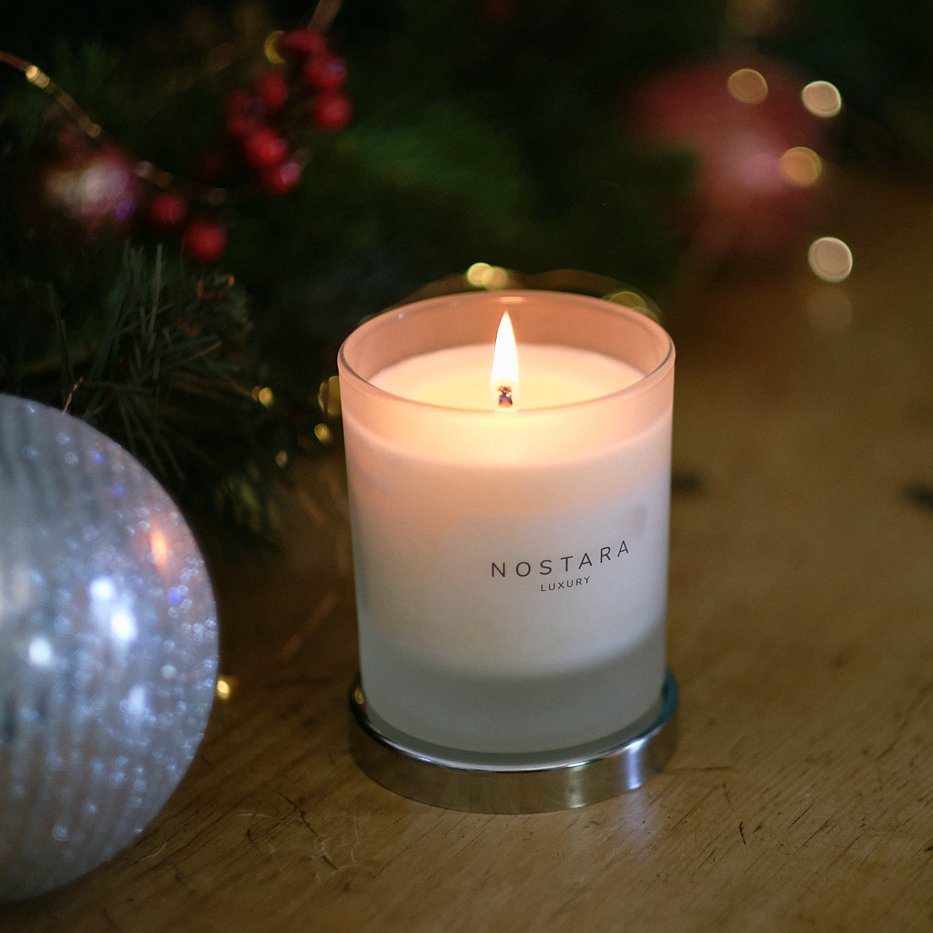 Nostara scented candle in christmas setting